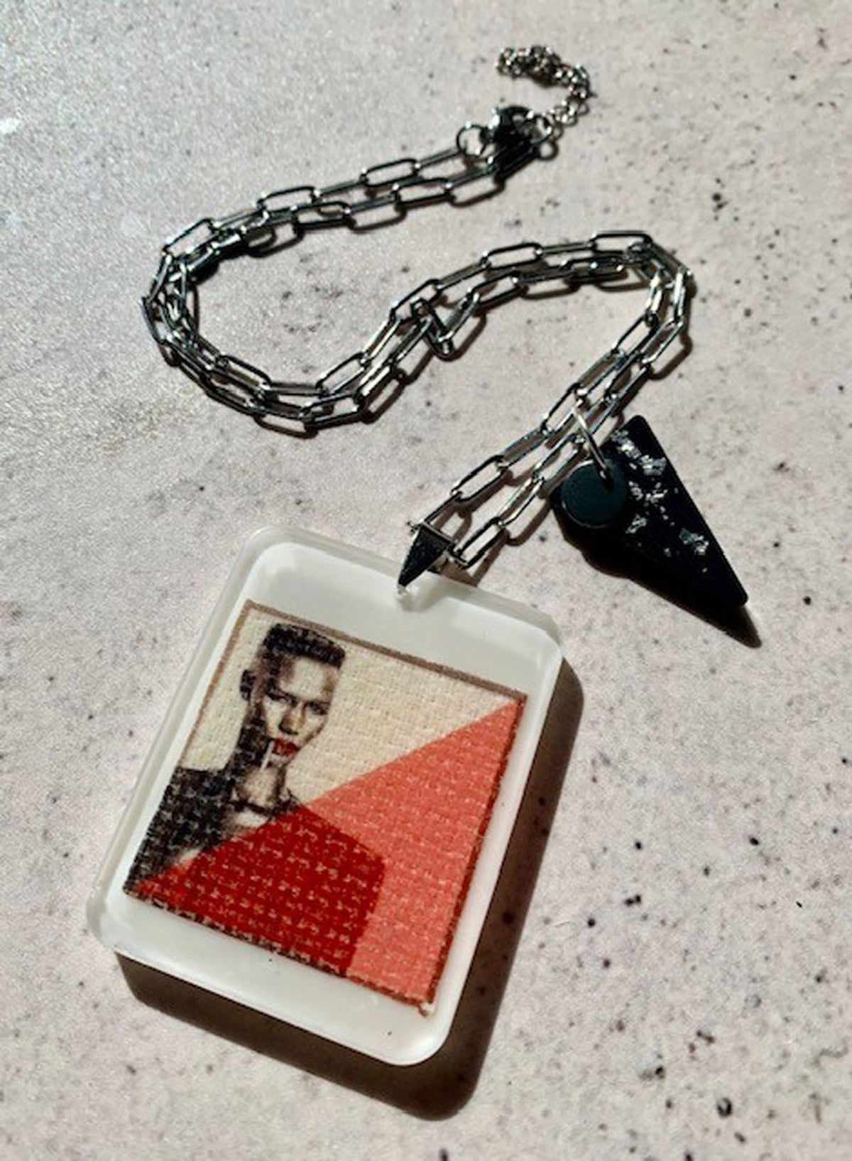 Necklace with hand crafted large resin ivory pendant with a pop art style image of Grace Jones 