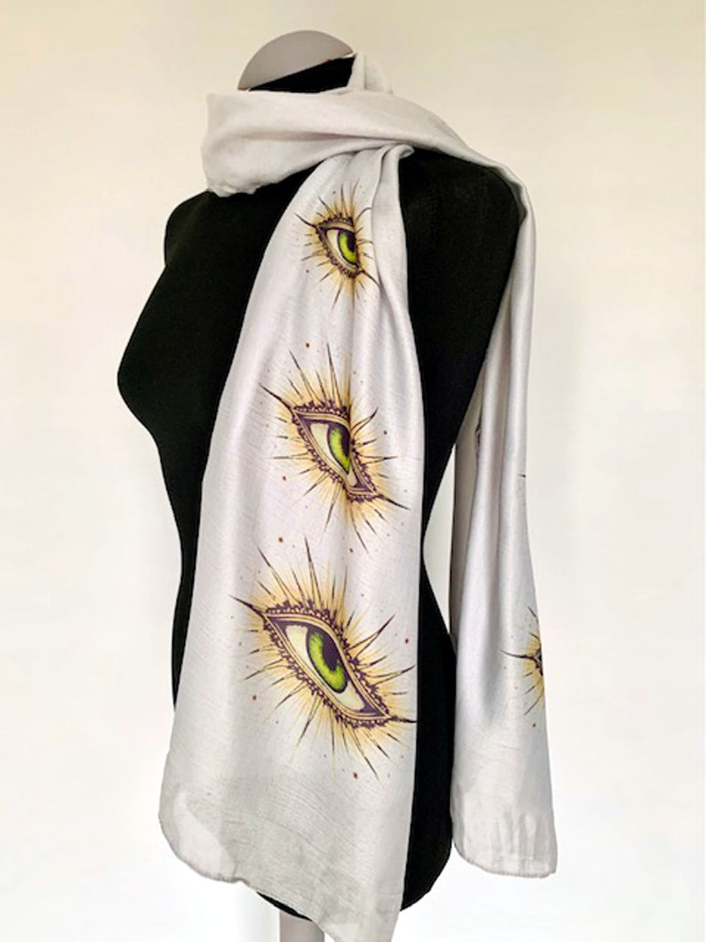 wearable art scarf on grey fabric with all seeing eye print