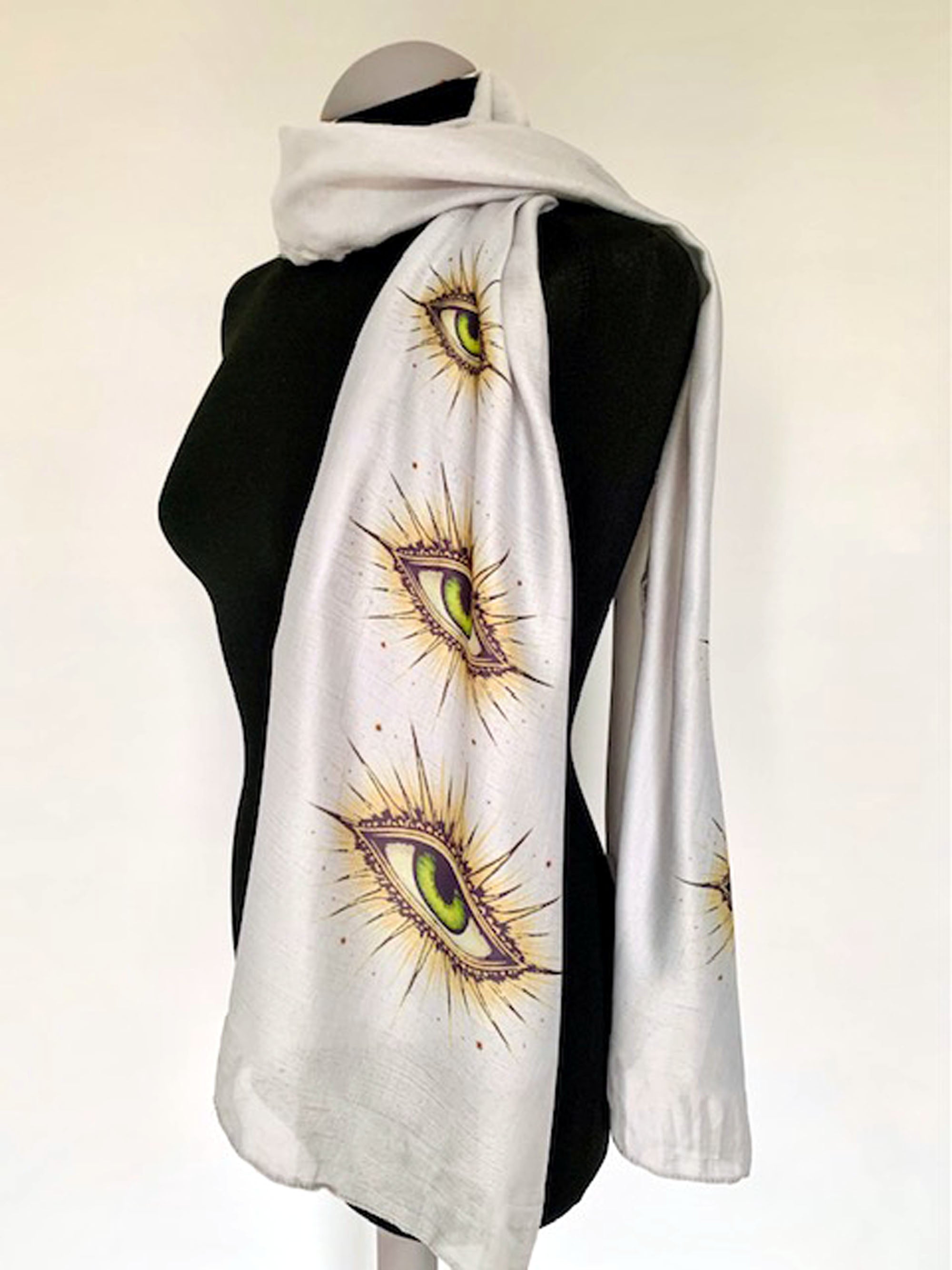 wearable art scarf on grey fabric with all seeing eye print