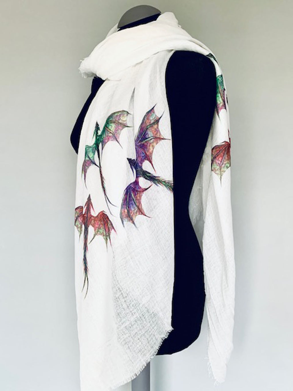 Wearable white art scarf wrap with colorful dragons print