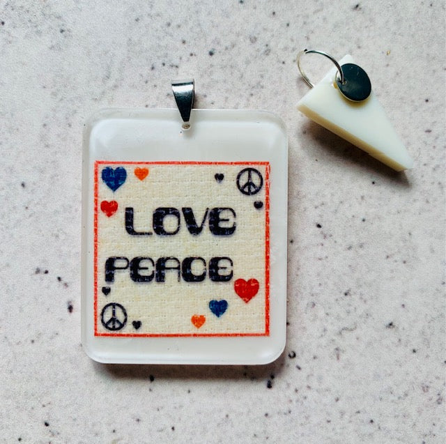 Love and Peace Resin Pendant Necklace. Mixed Media Art Jewellery. Stainless Steel Chain. Ivory Drop Pendant. Alternative Music Gift.