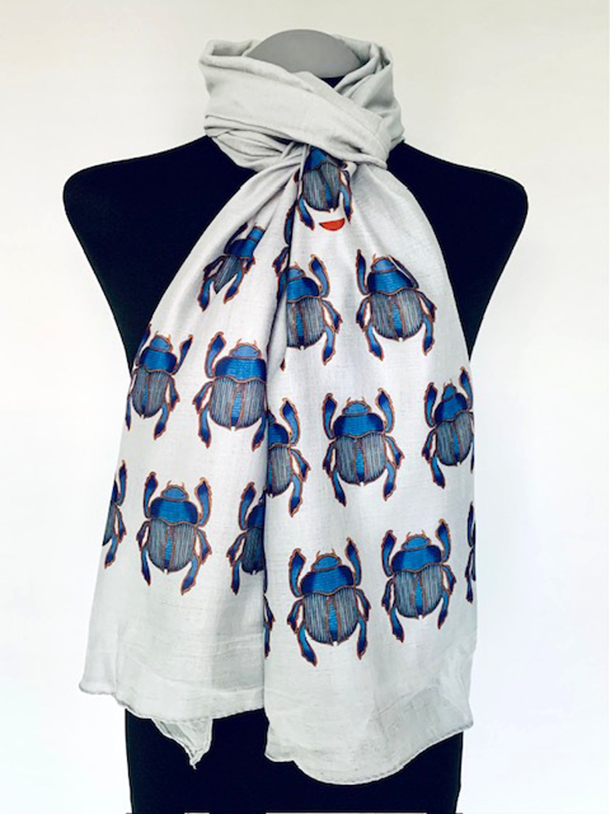 Wearable art scarf with blue scarab beetle egyptian print