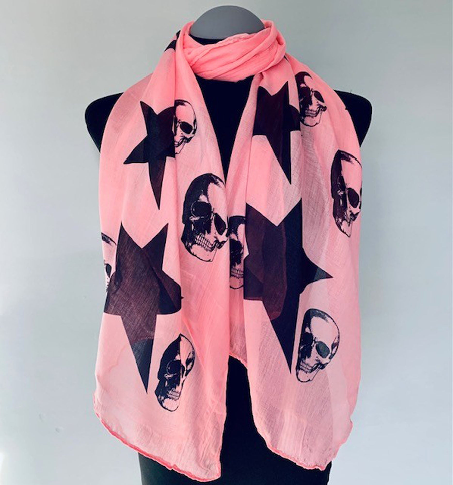 Wearable pink art scarf with skulls and stars print