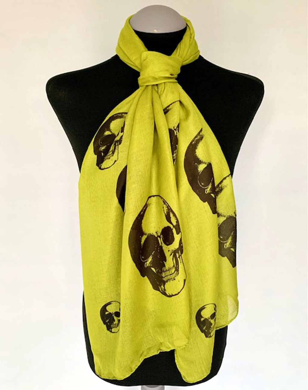 Wearable art scarf in army green with black skulls print