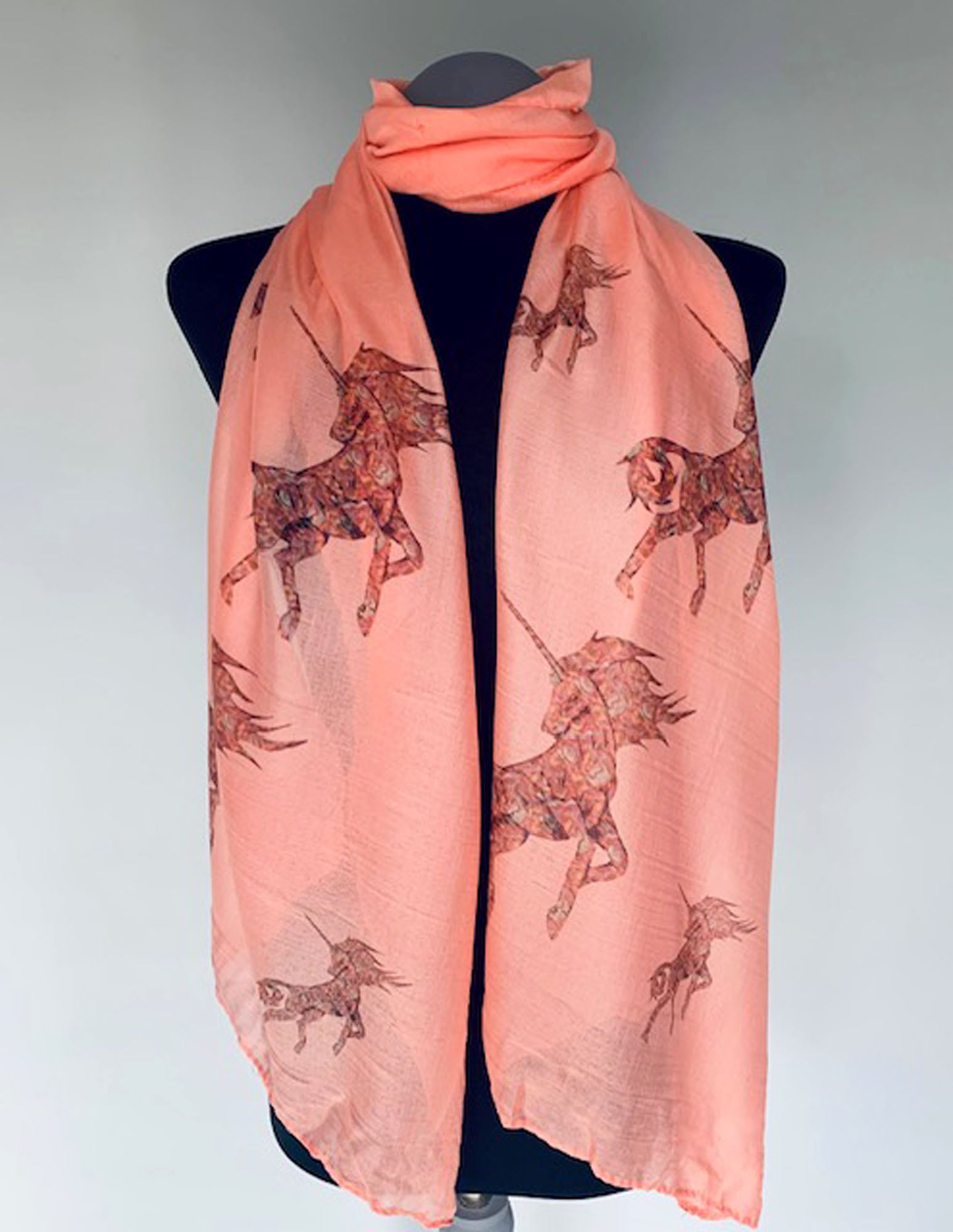 long pink scarf with unicorn print